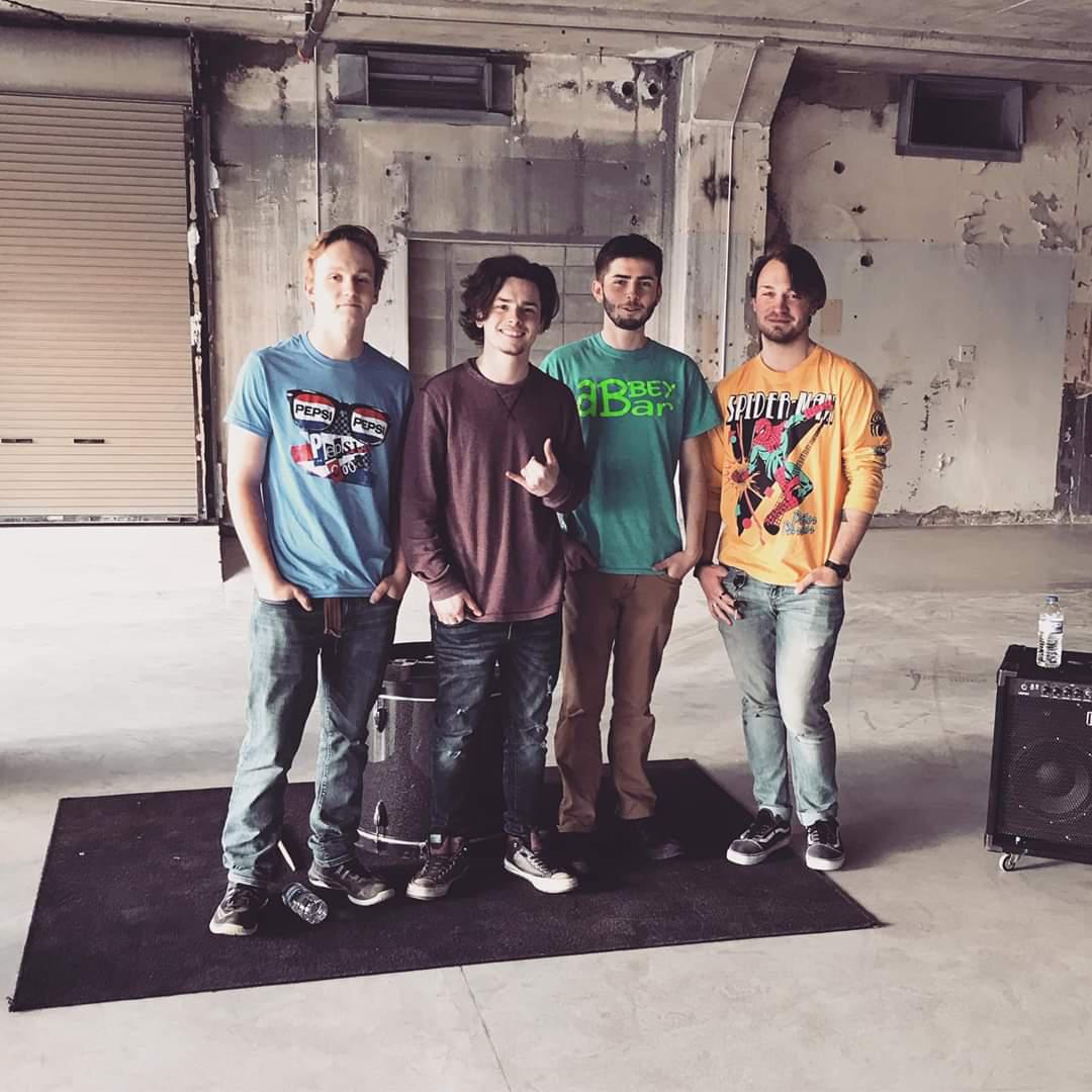 4 band members in a studio